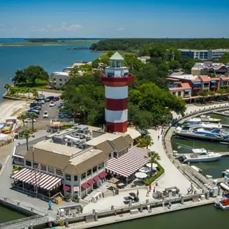 A lighthouse with a red and white stripe on it